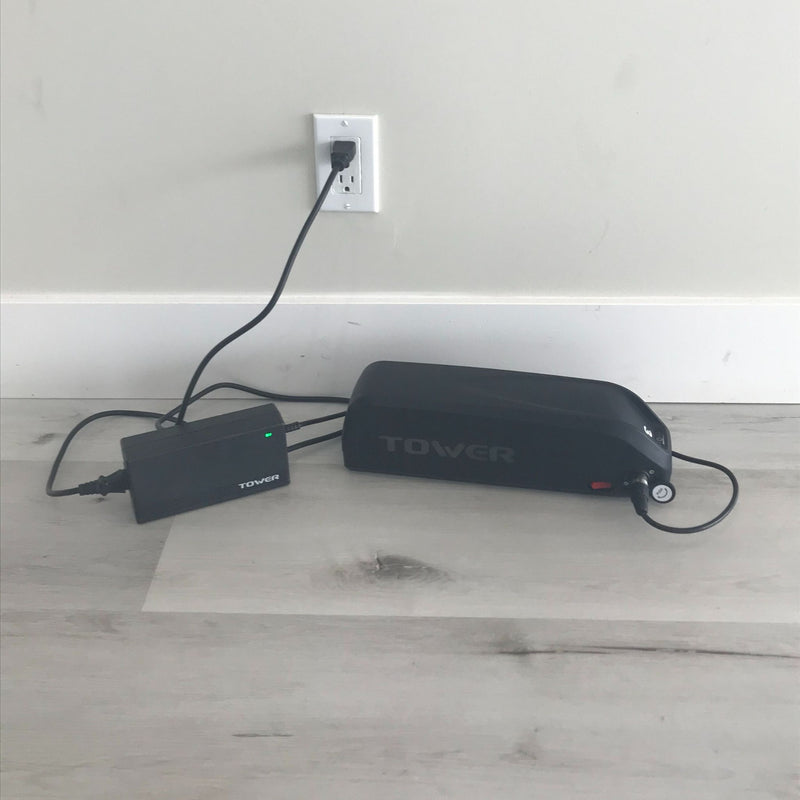 https://www.towerelectricbikes.com/cdn/shop/products/CHARGER-on-wall_800x.jpg?v=1679881949